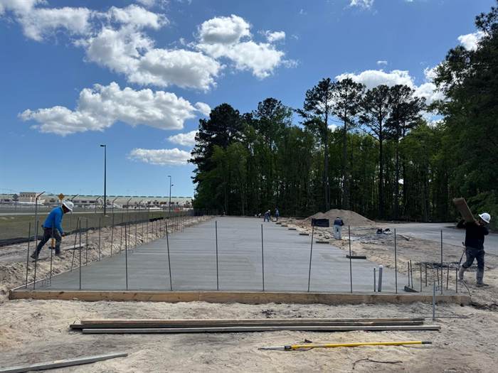 Commercial slab poured in strips with dowels and reinforcement projecting ready for the next placement