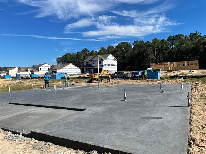 Finished residential slab with plumbing stub-ups in an established neighbourhood